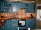 Kitchen interior of the Vestlia laftehytte, furniture designed in beautiful blue colour